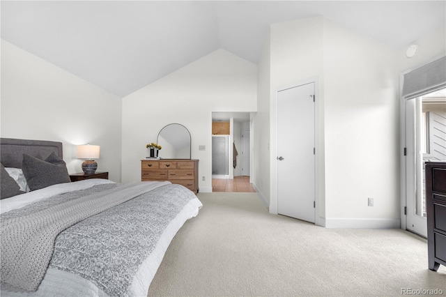 bedroom featuring light colored carpet, baseboards, and high vaulted ceiling