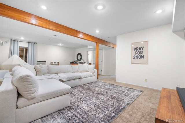 carpeted living room with recessed lighting and beam ceiling