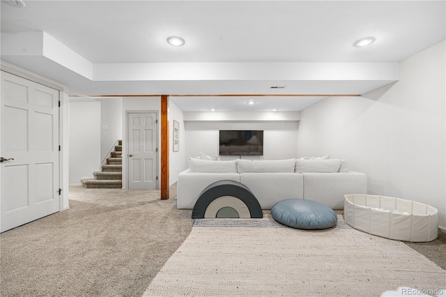 carpeted living room featuring recessed lighting, visible vents, and stairway