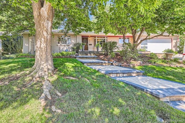 ranch-style house with a front lawn