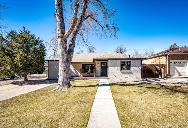 single story home featuring a porch, brick siding, a shingled roof, crawl space, and a front yard