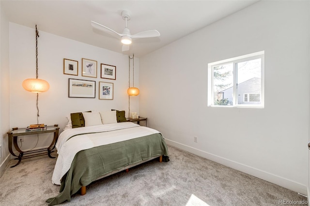 carpeted bedroom featuring baseboards