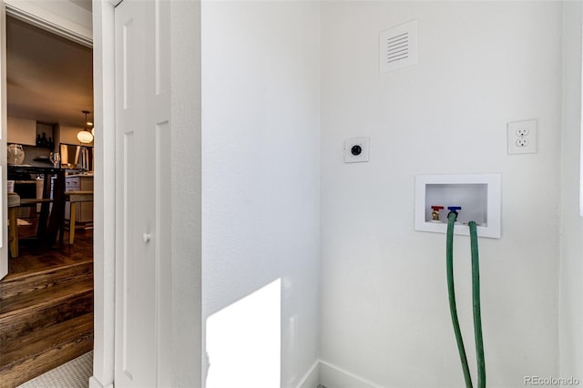 laundry room with hookup for a washing machine, wood finished floors, visible vents, and hookup for an electric dryer