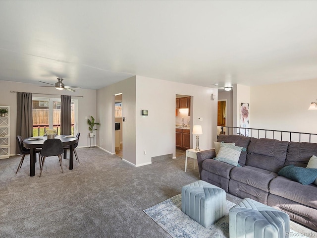 6869 Quay St, Arvada, CO 80003 - living room featuring carpet flooring, a ceiling fan, and baseboards