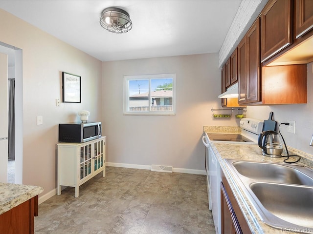 6869 Quay St, Arvada, CO 80003 - kitchen featuring stainless steel microwave, electric stove, a sink, under cabinet range hood, and light countertops