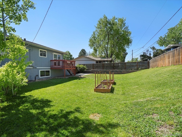 6869 Quay St, Arvada, CO 80003 - view of yard with a vegetable garden, a deck, and stairway