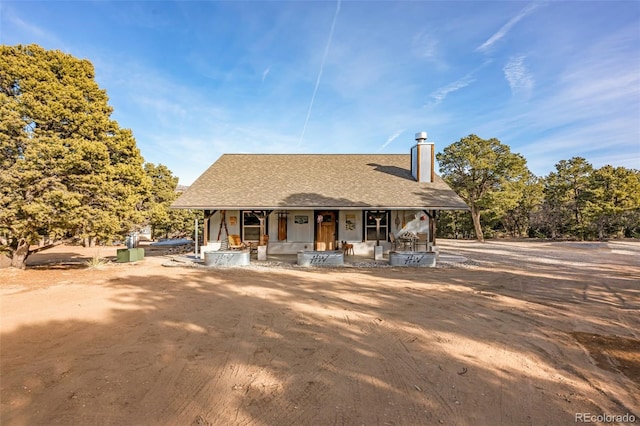830 High Peaks Ranch Rd, Coaldale, CO 81222 - view of front of home with a chimney, covered porch, and a shingled roof