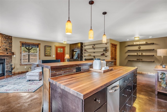 830 High Peaks Ranch Rd, Coaldale, CO 81222 - kitchen featuring butcher block countertops, finished concrete flooring, open floor plan, pendant lighting, and a fireplace