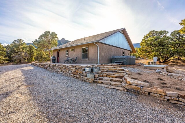 830 High Peaks Ranch Rd, Coaldale, CO 81222 - view of home's exterior featuring a patio area and a hot tub