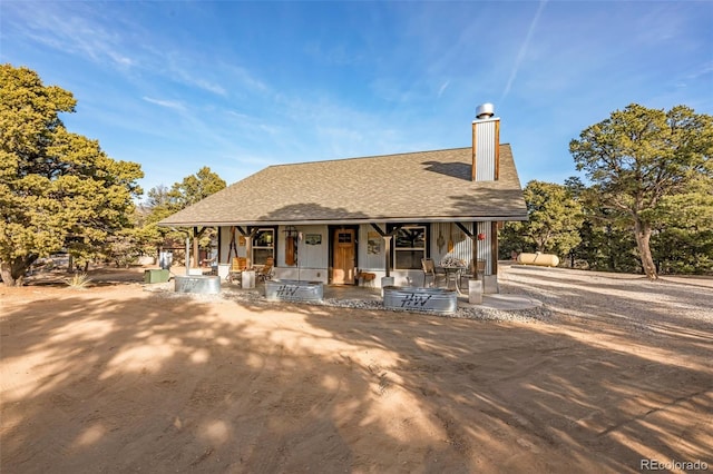 830 High Peaks Ranch Rd, Coaldale, CO 81222 - back of house featuring covered porch, a chimney, and roof with shingles