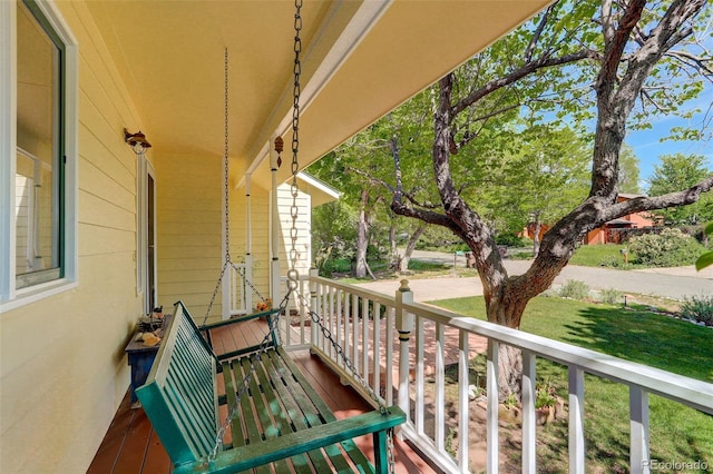 balcony featuring a porch