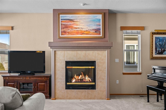 living room with light carpet and a fireplace