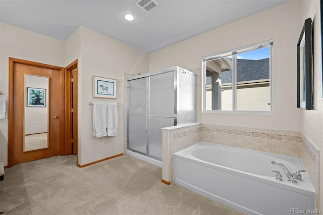 bathroom featuring separate shower and tub