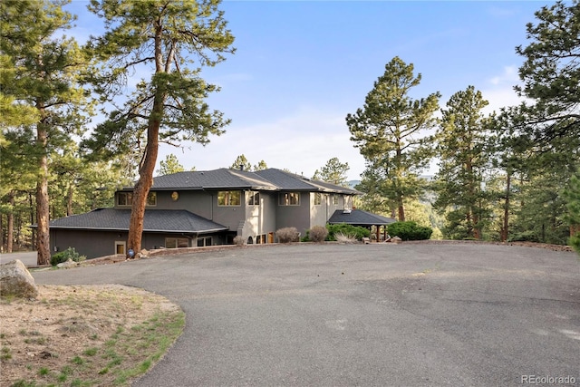 28890 Pinewood Vista Dr, Evergreen, CO 80439 - view of front facade featuring aphalt driveway
