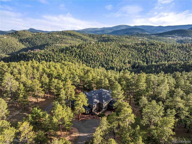 28890 Pinewood Vista Dr, Evergreen, CO 80439 - bird's eye view featuring a view of trees and a mountain view