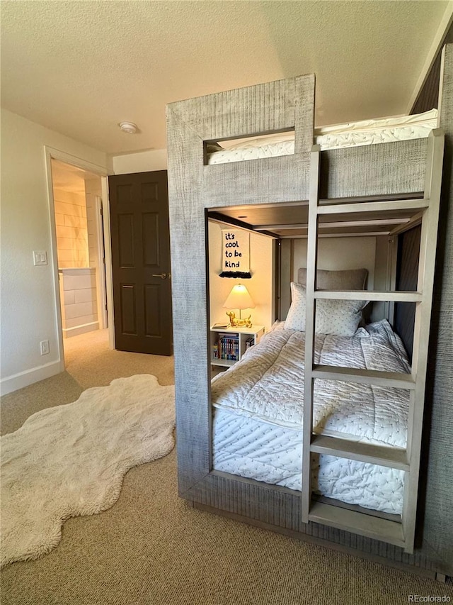 8503 E Jamison Ave, Centennial, CO 80112 - unfurnished bedroom with baseboards, carpet flooring, and a textured ceiling