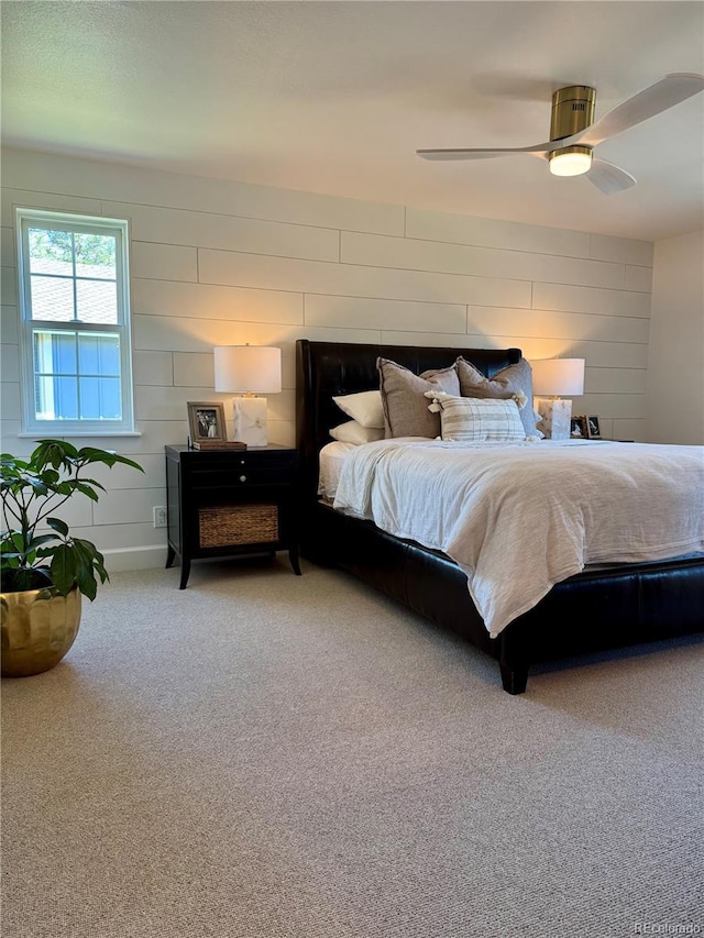 8503 E Jamison Ave, Centennial, CO 80112 - carpeted bedroom featuring wooden walls and ceiling fan