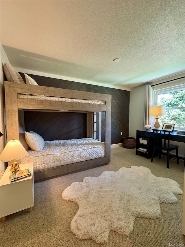 8503 E Jamison Ave, Centennial, CO 80112 - carpeted bedroom featuring wooden walls and a textured ceiling