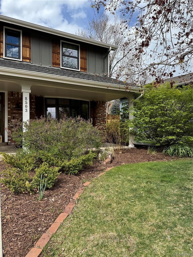 8503 E Jamison Ave, Centennial, CO 80112 - exterior space featuring board and batten siding and a front yard