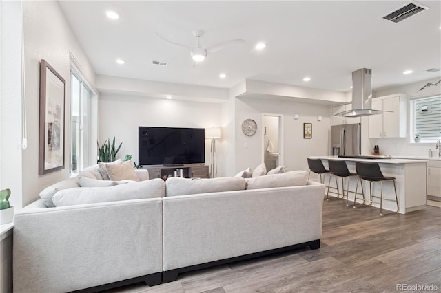 1284 Quitman St, Denver, CO 80204 - living room with ceiling fan, wood finished floors, and recessed lighting