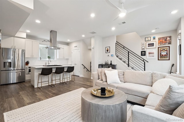 1284 Quitman St, Denver, CO 80204 - living area with dark wood-type flooring, stairs, recessed lighting, and ceiling fan
