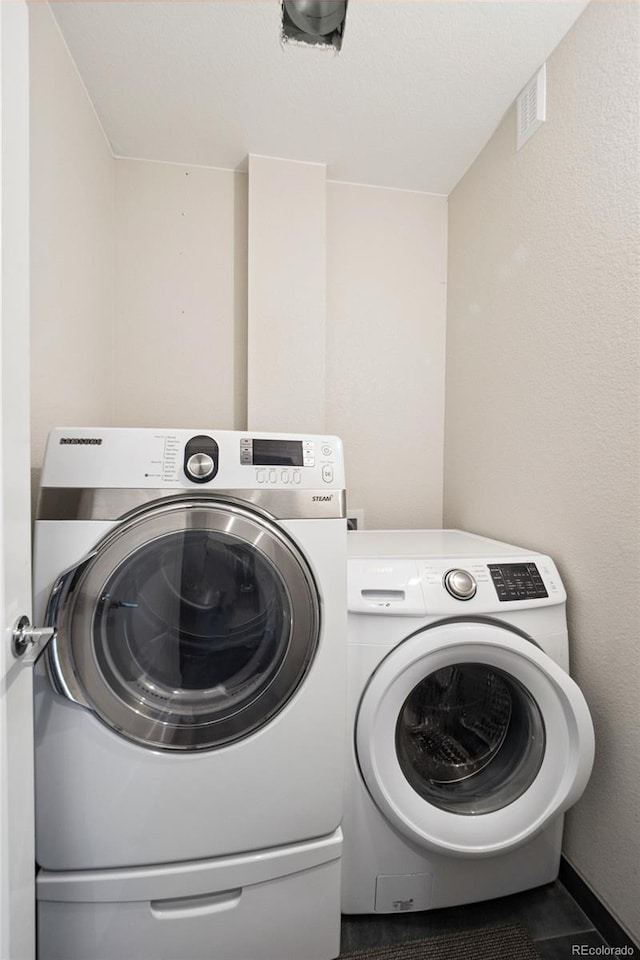1284 Quitman St, Denver, CO 80204 - washroom featuring washing machine and dryer
