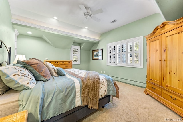 bedroom with recessed lighting, visible vents, baseboard heating, light carpet, and vaulted ceiling