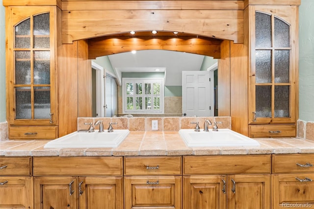 bathroom featuring double vanity and a sink