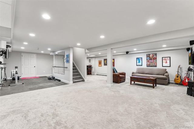 exercise area featuring a baseboard heating unit, recessed lighting, carpet flooring, and baseboards