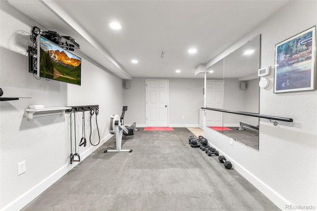 workout room featuring baseboards and recessed lighting