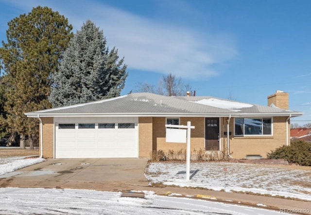 ranch-style house featuring a garage