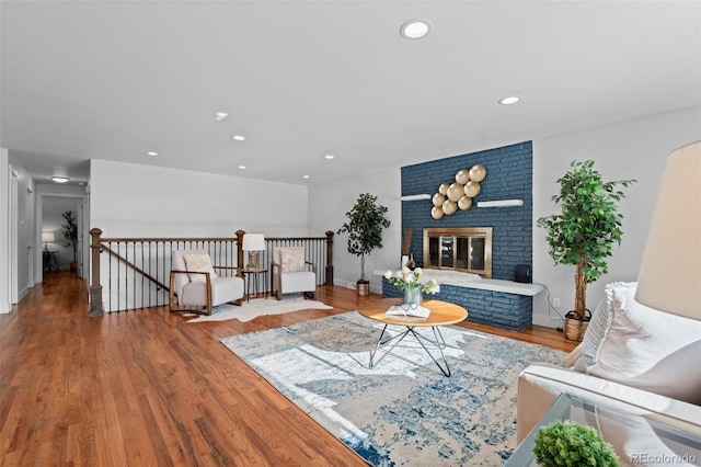 living room featuring hardwood / wood-style flooring and a fireplace