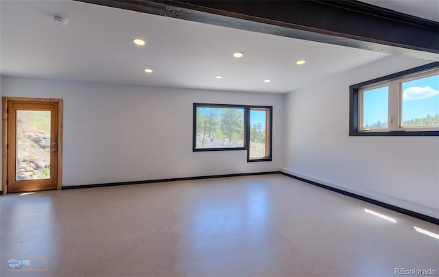 548 Coughlin Meadows Rd, Boulder, CO 80302 - empty room featuring healthy amount of natural light, recessed lighting, concrete flooring, and a smoke detector