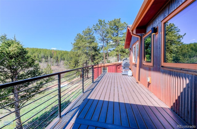 548 Coughlin Meadows Rd, Boulder, CO 80302 - wooden terrace with a wooded view and grilling area