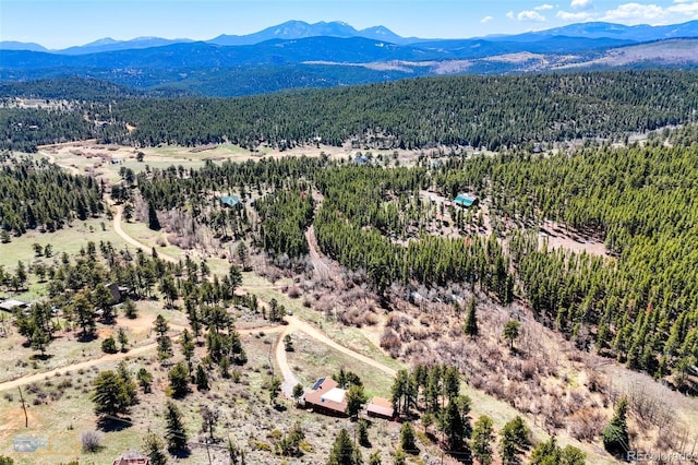548 Coughlin Meadows Rd, Boulder, CO 80302 - aerial view of a mountain backdrop and a heavily wooded area