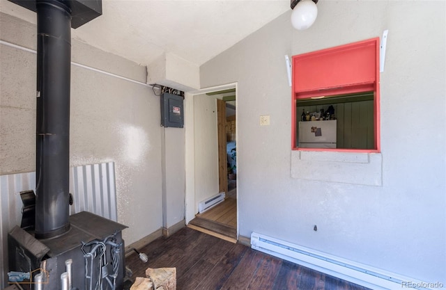 548 Coughlin Meadows Rd, Boulder, CO 80302 - corridor with a baseboard heating unit, wood finished floors, electric panel, and vaulted ceiling