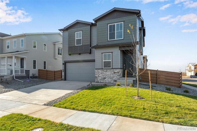 13502 E 100th Ave, Commerce City, CO 80022 - view of front of house featuring stone siding, concrete driveway, and an attached garage
