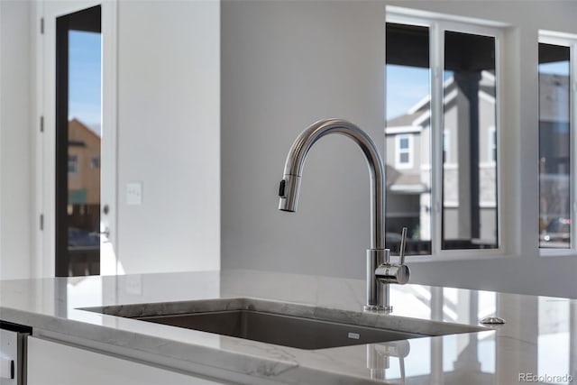 13502 E 100th Ave, Commerce City, CO 80022 - kitchen view of a sink and light stone countertops