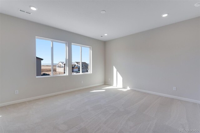 13502 E 100th Ave, Commerce City, CO 80022 - empty room with light colored carpet, baseboards, and recessed lighting
