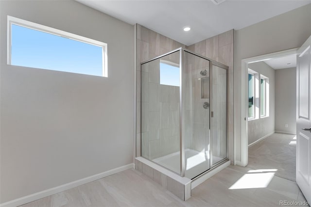 13502 E 100th Ave, Commerce City, CO 80022 - bathroom with plenty of natural light, a shower stall, baseboards, and recessed lighting