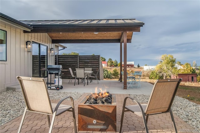 view of patio with an outdoor fire pit