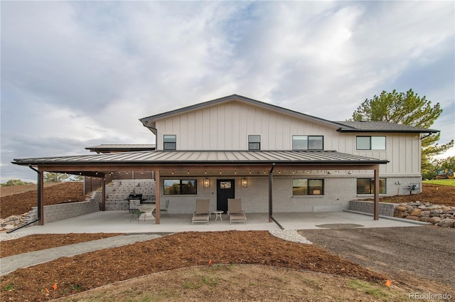 back of property with a patio