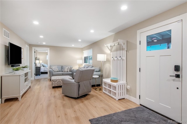 living room with light hardwood / wood-style flooring