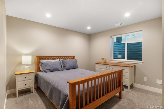 bedroom with light colored carpet