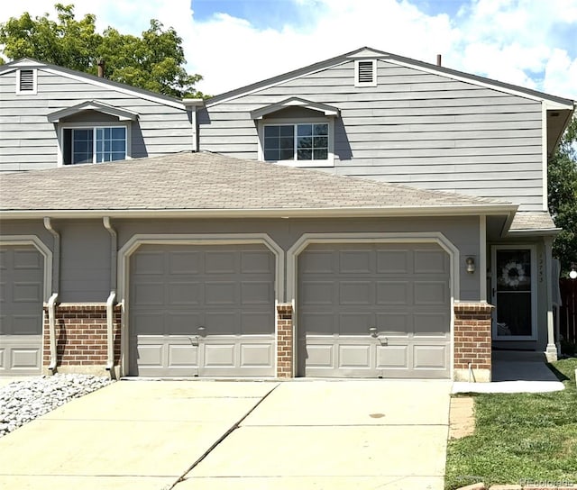 12753 Elm St, Thornton, CO 80241 - garage featuring concrete driveway