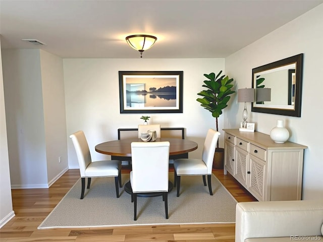 12753 Elm St, Thornton, CO 80241 - dining space with light wood finished floors and baseboards