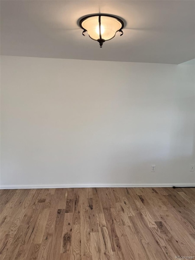 12753 Elm St, Thornton, CO 80241 - unfurnished room featuring wood finished floors and baseboards