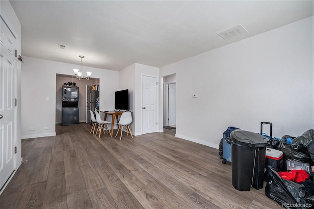 interior space featuring hardwood / wood-style flooring and a chandelier