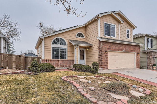 view of front of house featuring a front lawn and a garage