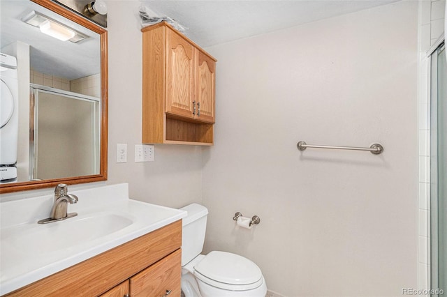 full bath featuring a shower with door, vanity, and toilet